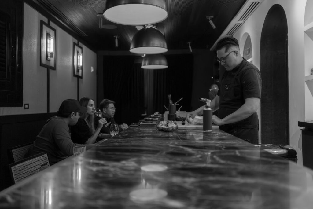 The chef and his assistants prepare dishes with seafood products, such as King Salmon, Bluefin Toro, Unagi, and Kanpachi/Photo: Brian Contreras