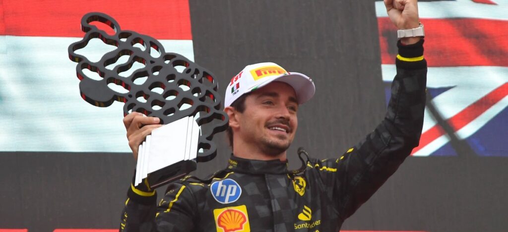 Leclerc raises the Italian Grand Prix trophy for Ferrari / Photo via Ferrari