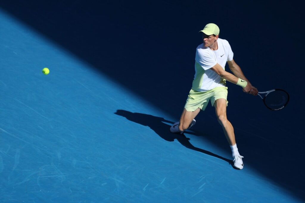 Jannik Sinner (Ita) in action during his 1st round men's singles match against Nicolas Jarry (Chi) on day two of the Australian Open at Melbourne Park / Photo via Rolex/Antoine Couvercelle