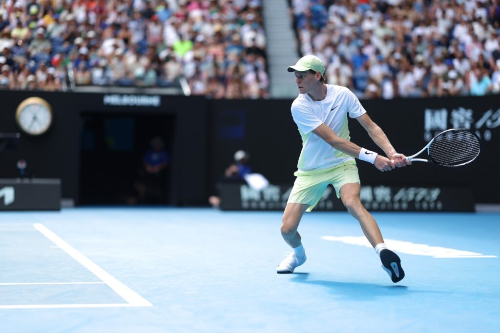 Jannik Sinner (Ita) in action during his 1/8 final round men's singles match against Holger Rune (Den) on day nine of the Australian Open at Melbourne Park / Photo via Rolex/Antoine Couvercelle