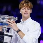 Jannik Sinner (ITA) lifts trophy following victory in the Mens Singles Final of the Australian Open at Melbourne Park / Photo via Rolex/Antoine Couvercelle