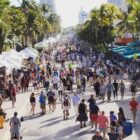 People walking at Miami Art Deco District / Photo via Art Deco Weekend