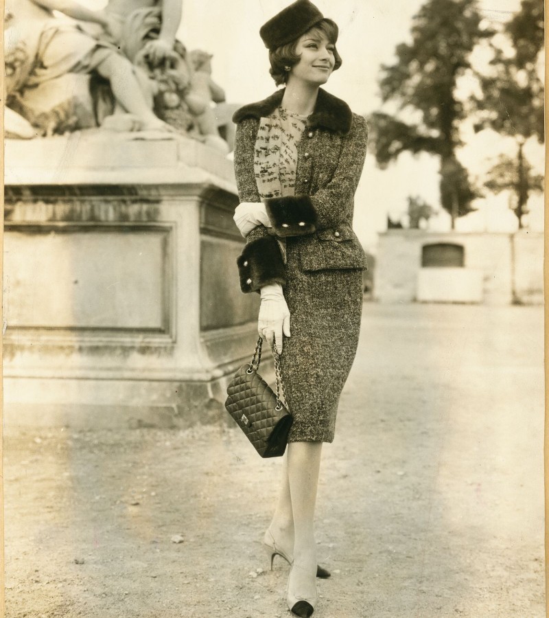 Chanel house model Marie-Hélène Arnaud in a Chanel tweed suit from the autumn/winter 1959 collection / Photo via CHANEL