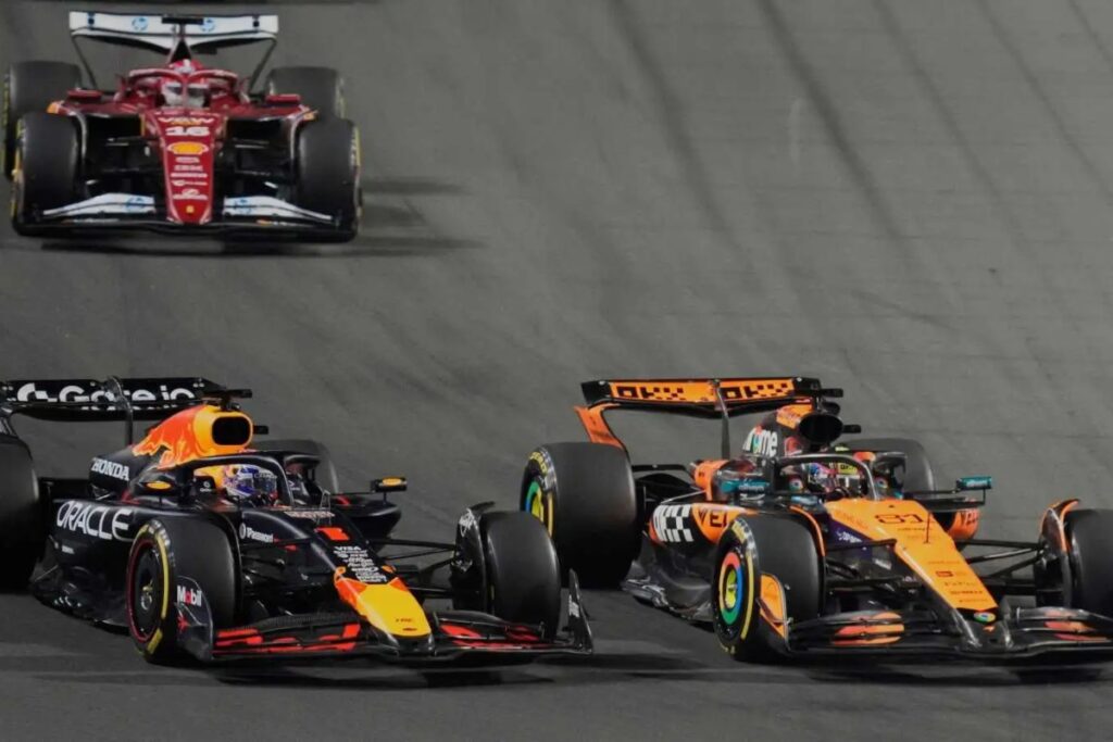 erstappen retained the lead through the first corner but ran wide at Turn 2 as Piastri made an aggressive move on the inside / Photo via F1