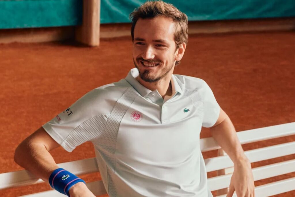 One standout is the Men's Heritage Tennis Polo worn by Fils in the campaign. Featuring a traditional white and green color scheme, this limited-edition polo has not yet been released online / Photo Lacoste