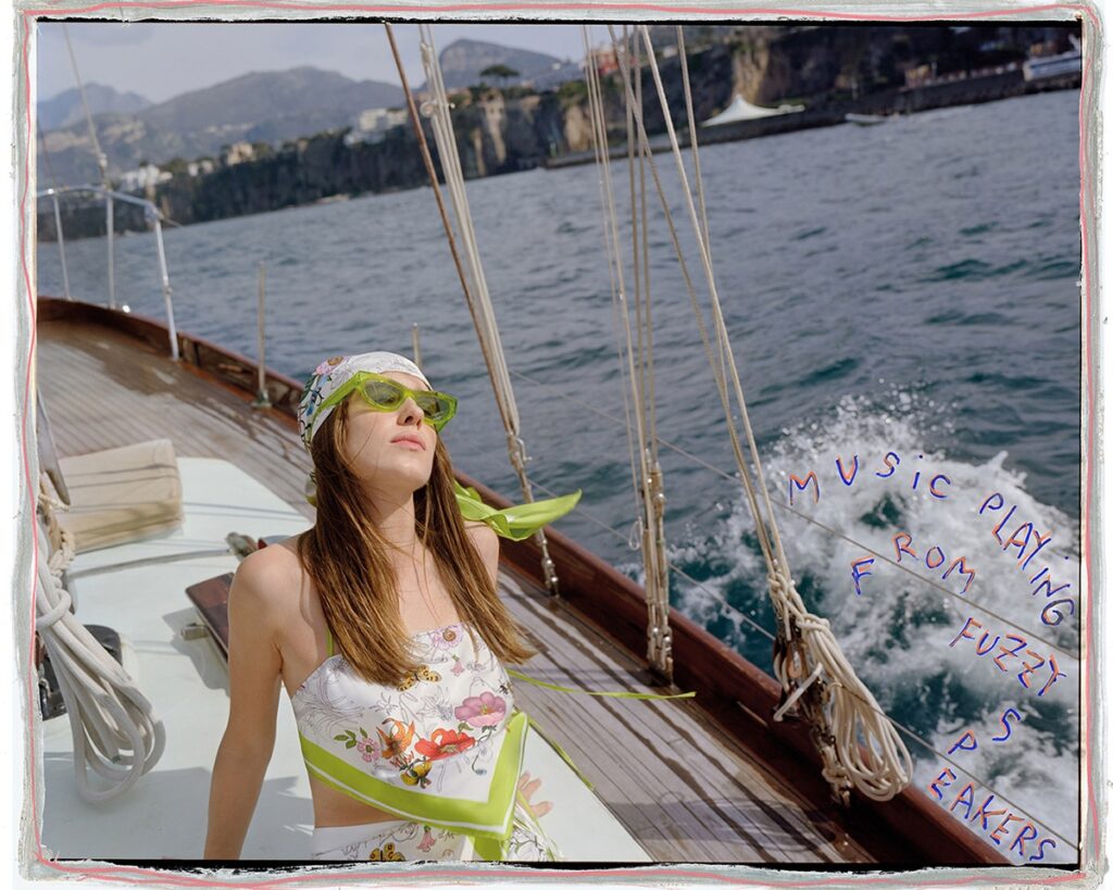 The film follows the trio from sun-kissed coastlines to tranquil villas, enhancing the campaign’s dreamy, cinematic quality. / Photo Gucci
