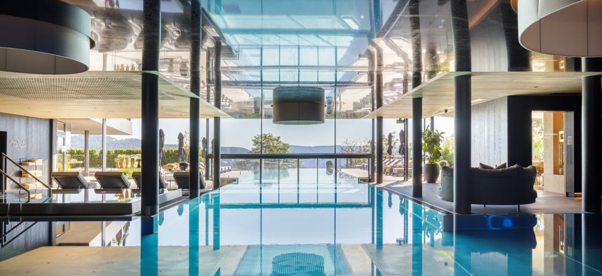 At the Hotel Chalet Mirabell, with its panoramic window wall, opens to jaw-dropping alpine views stretching across Italian and Austrian peaks. / Photo Mirabell Hotel