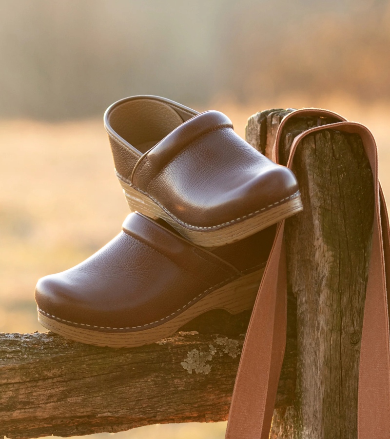 Their versatility is part of their charm. The latest shoe trends show clogs as both fashionable and functional, worn with everything from denim to dresses. / Photo Dansko