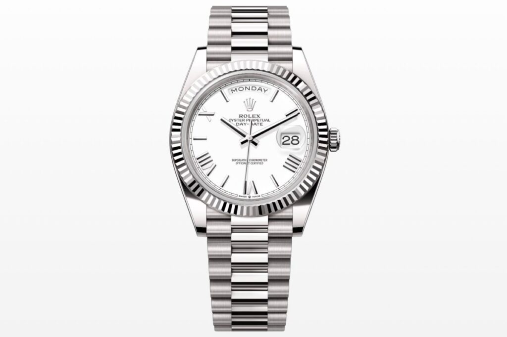 white gold Rolex Day-Date with a white dial and Roman numeral markers / Photo via Rolex