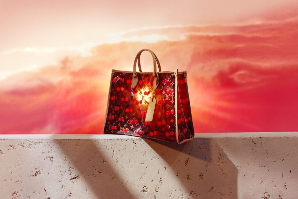 Set against a crisp white background, this fresh interpretation acts as a blank canvas for a 3D-printed Cherry design that shines with an even more playful, high-gloss finish / Photo via Louis Vuitton