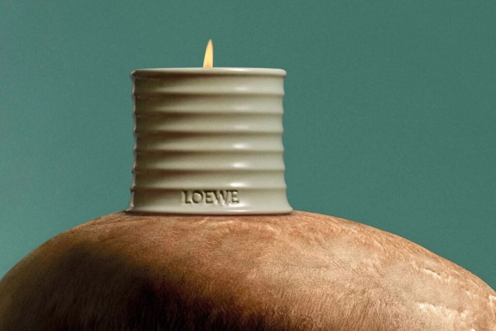 Add a bit of comfort to his sanctuary with a Loewe candle or a luxurious throw blanket from Toast. / Photo Loewe