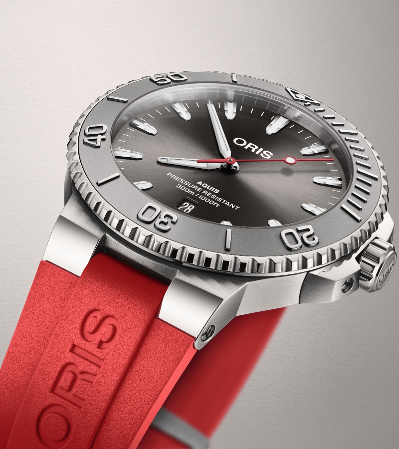 Crafted in stainless steel and water-resistant up to 300 meters, it's built for both deep-sea explorers and style-conscious wearers. / Phoro Oris