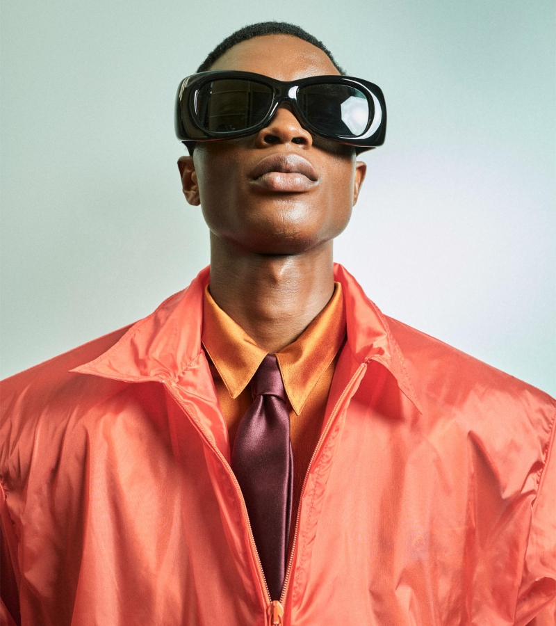 Pastel tones, sheer fabrics, power shoulders, and tie-tucked shirts.