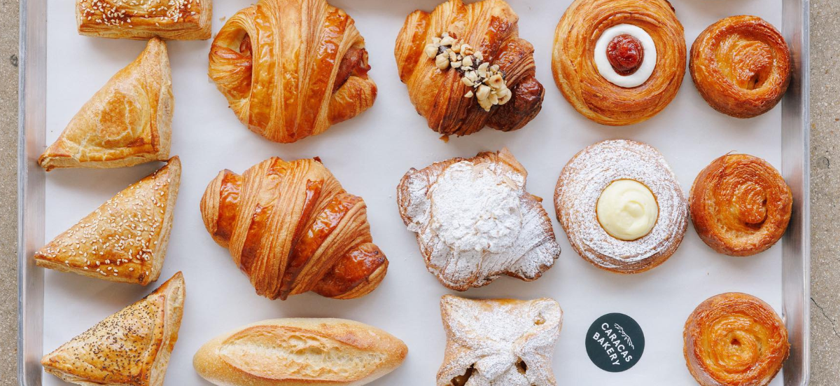 Manuel and Jesus Brazon’s passion now fuels a thriving bakery known for its artisanal bread, viennoiseries, and a breakfast menu that has people lining up every morning / Photo IG: @caracas.bakery