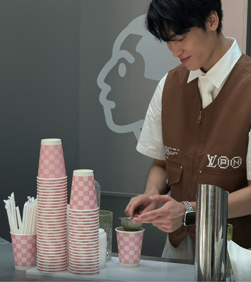 At the heart of this unique presentation is a specially curated matcha drink, which embodies the collection's refined energy and color palette. / Photo via Louis Vuitton