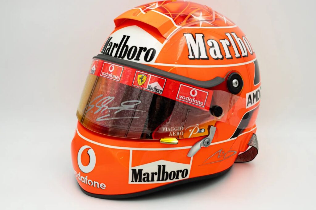 A 2005 Schuberth RF1 helmet from his Ferrari years, a 1991 Arai helmet from his debut season / Photo Sothebys