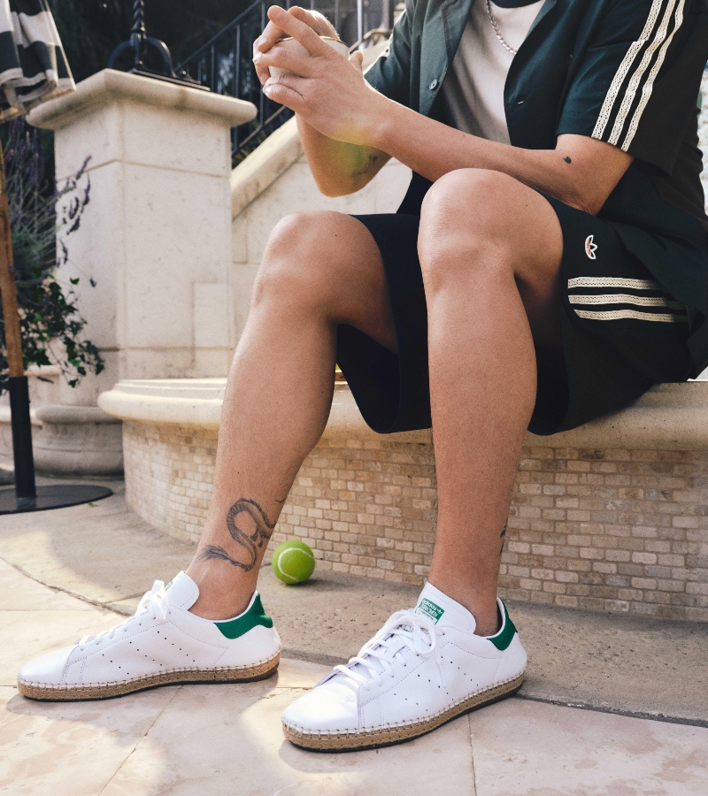 The color palette blends forest greens, creams, browns, and soft hints of maroon and gold / Photo via Adidas