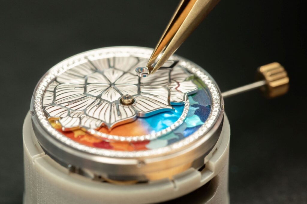 Crafted from iridescent mother-of-pearl marquetry, the disc gently shifts shades as the year unfolds / Photo Chopard