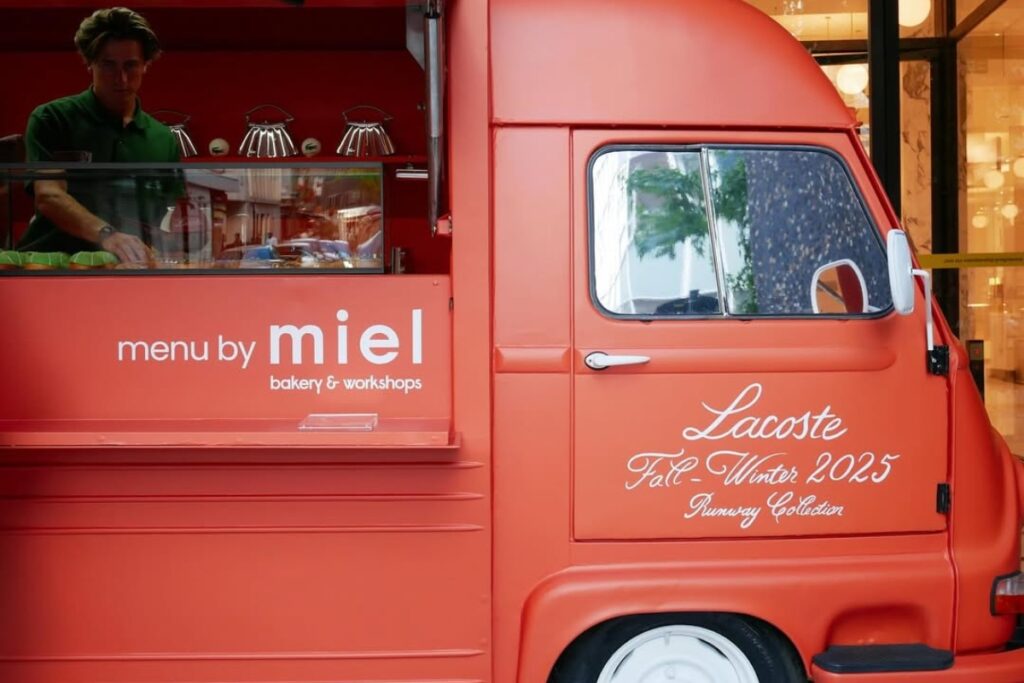 The Lenglen Bag draws inspiration from the iconic pleated tennis skirt, both in silhouette and attitude / Photo via Lacoste