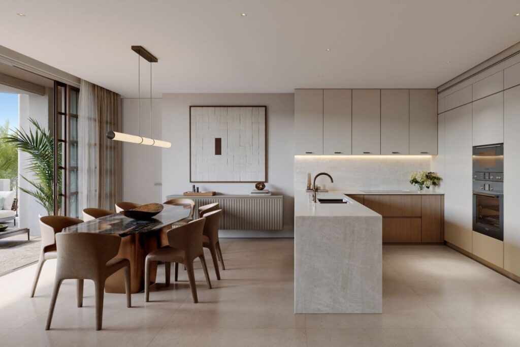 The design combines traditional elements like terracotta roof tiles, textured stucco, and decorative cornices with modern accents including glass canopies, bronze railings, and intricate Mashrabiya panels / Photo Alhambra Parc