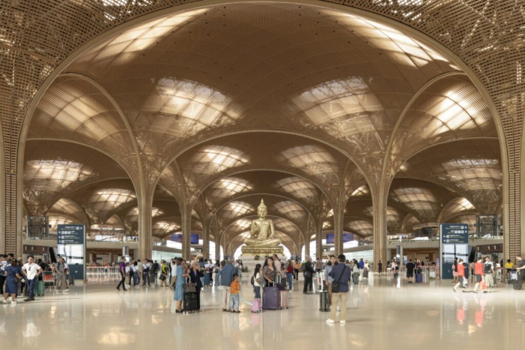 The design draws from Cambodia’s vernacular architecture, particularly temples and palaces, and incorporates elements like latticed panels and vaulted roofs to reflect local culture and climate. / Photo via Foster + Partners