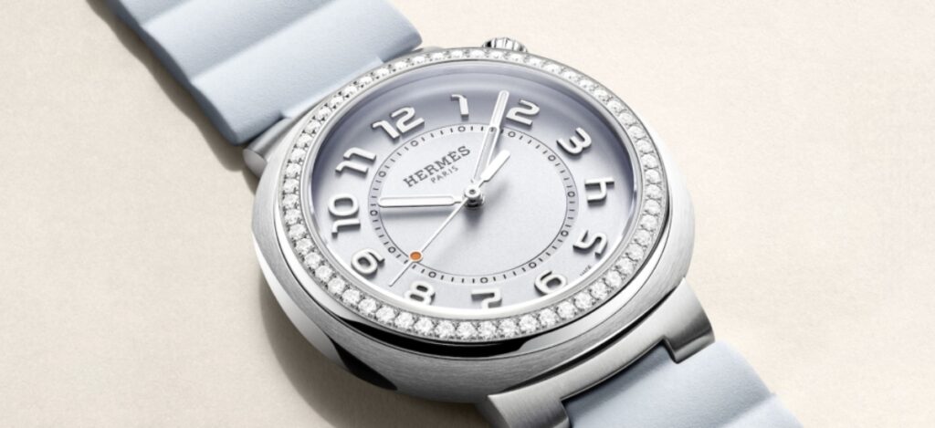 Its unique “cut” case design and crown positioned at 1:30 break traditional watchmaking symmetry, giving it a distinctive silhouette that feels both modern and timeless. / Photo via Hermès