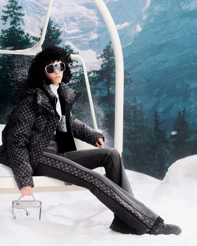Meanwhile, the LV Cloud boots mirror the motifs used in nylon and taffeta jackets, blending contemporary sportswear aesthetics with mountain-ready functionality / Photo via Louis Vuitton