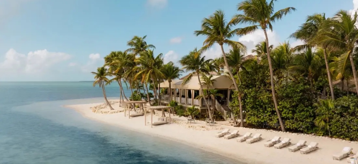 It’s in the Florida Keys, accessible only by boat or seaplane, offering complete privacy and luxury. / Photo via Little Palm Island Resort & Spa