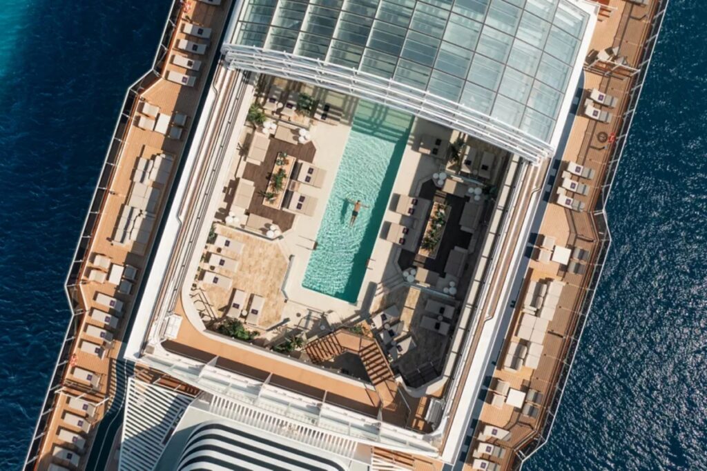 Of course, adventure and awareness unfold in style aboard the magnificent Explora II, the 814-foot vessel designed to redefine what luxury at sea feels like. / Photo via Explora (Journeys)