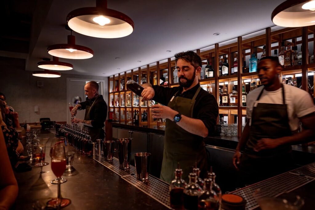 The space unfolds underground, warm, intimate, and softly illuminated. Design balances retro glamour with understated modern restraint. / Photo Seed Library