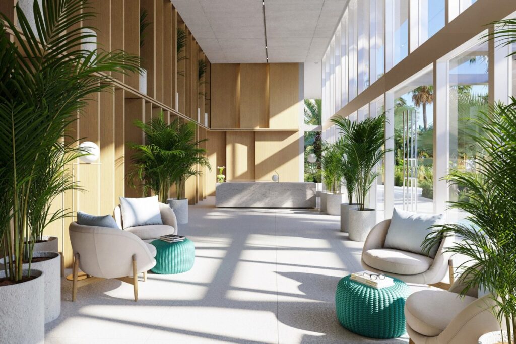 Floor-to-ceiling windows frame serene waterway views. The interior flows directly onto a trellised outdoor terrace. / Photo 990 West